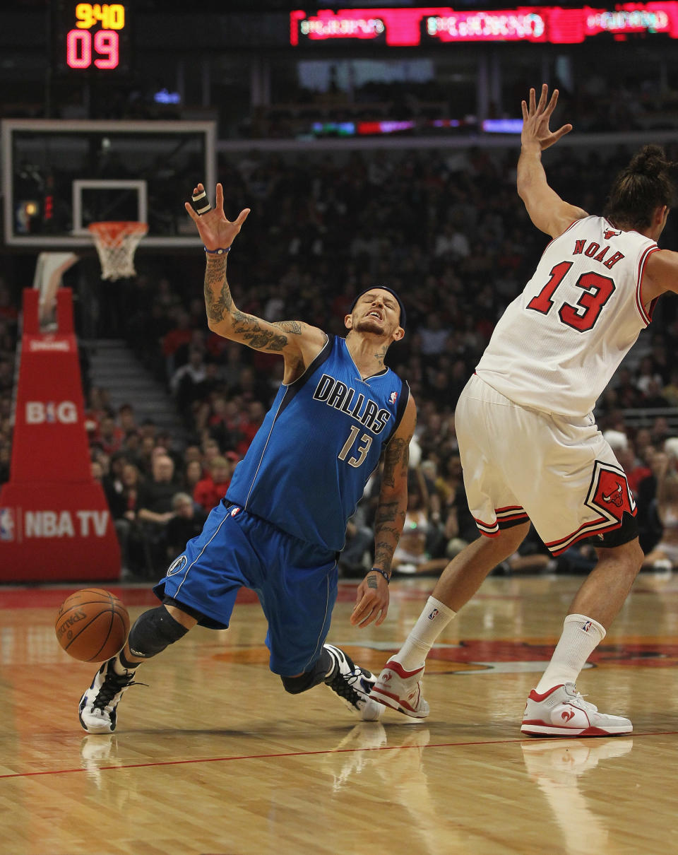 CHICAGO, IL - APRIL 21: Delonte West #13 of the Dallas Mavericks looses the ball after running into Jaokim Noah #13 of the Chicago Bulls at the United Center on April 21, 2012 in Chicago, Illinois. NOTE TO USER: User expressly acknowledges and agress that, by downloading and/or using this photograph, User is consenting to the terms and conditions of the Getty Images License Agreement. (Photo by Jonathan Daniel/Getty Images)