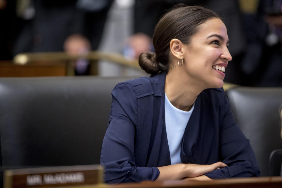 Rep. Alexandria Ocasio-Cortez, D-N.Y., arrives before David Marcus, CEO of Facebook's Calibra digital wallet service, testifies before a House Financial Services Committee hearing on Facebook's proposed cryptocurrency on Capitol Hill in Washington, Wednesday, July 17, 2019. (AP Photo/Andrew Harnik)