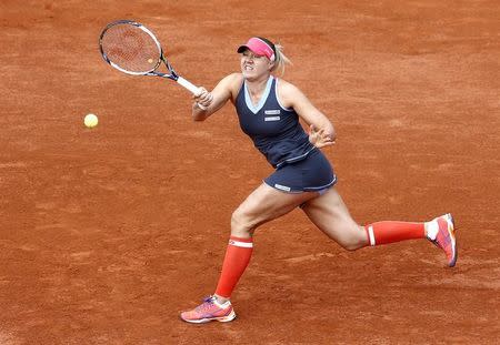 Kaia Kanepi of Estonia plays a shot to Maria Sharapova of Russia during their women's singles match at the French Open tennis tournament at the Roland Garros stadium in Paris, France, May 25, 2015. REUTERS/Jean-Paul Pelissier