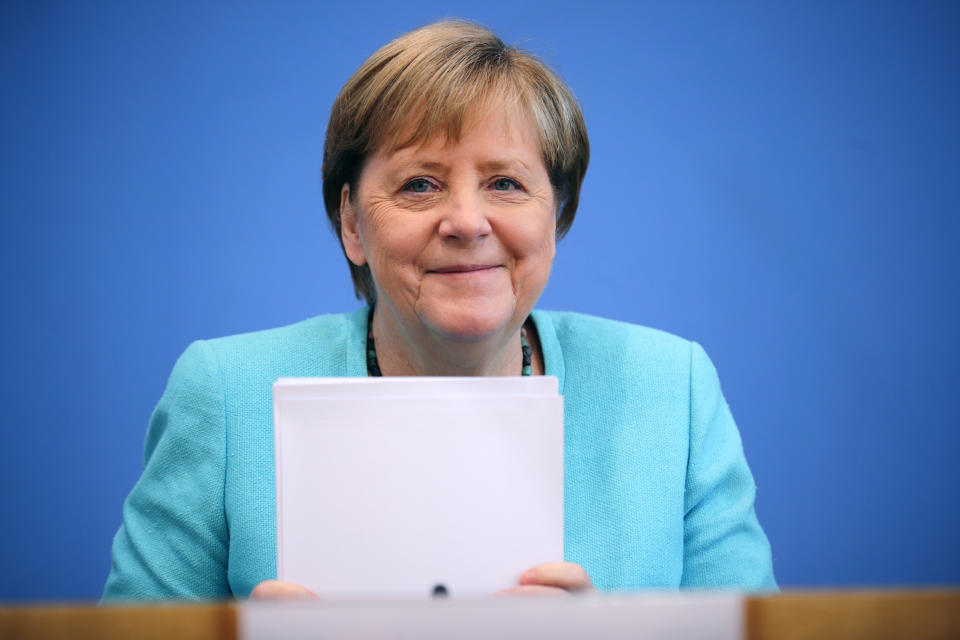 German Chancellor Angela Merkel, smiles as she holds her annual summer news conference in Berlin, Germany, Thursday, July 22, 2021. (Hannibal Hanschke/Pool Photo via AP)