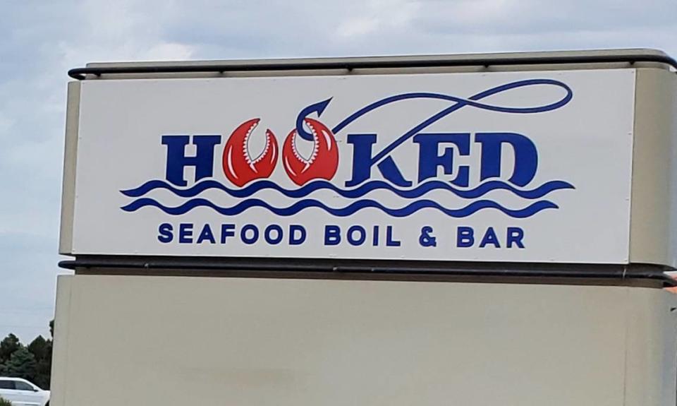 A sign for Hooked Seafood Boil & Bar has gone up in Kennewick for the restaurant west of Columbia Center mall.