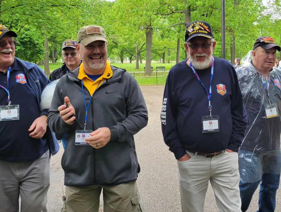Blue Ridge Honor Flight veteran Ronnie Robinson, second from right, shares a laugh with his other Mars Hill veterans on April 27 in Washington, D.C.