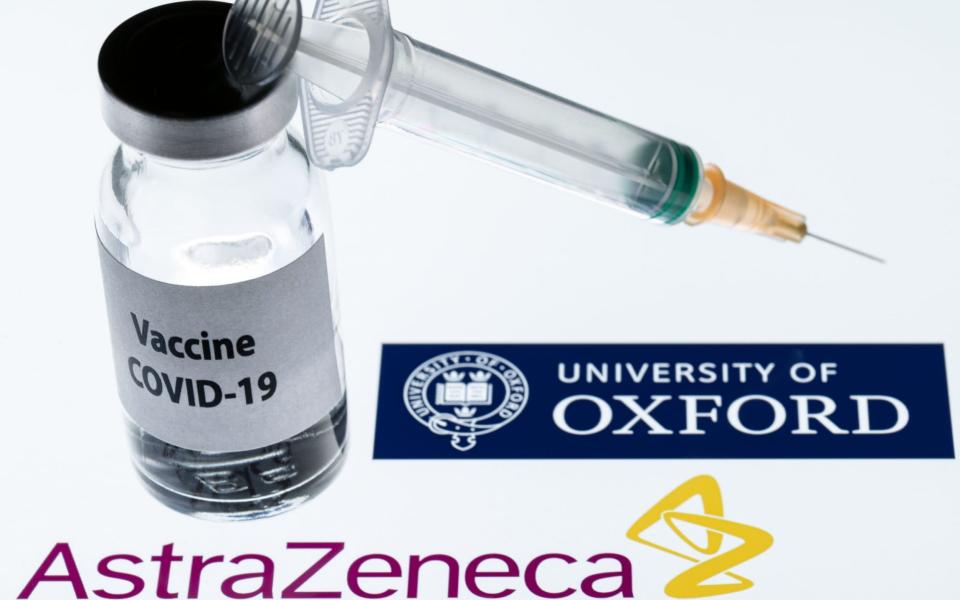 (FILES) This file illustration picture taken in Paris on November 23, 2020 shows a syringe and a bottle reading "Covid-19 Vaccine" next to AstraZeneca company and University of Oxford logos. - The Covid-19 vaccine developed by the British drugs group AstraZeneca and the University of Oxford has achieved a "winning formula" for efficacy, the company's chief executive said on Sunday, December 27. (Photo  - JOEL SAGET/AFP via Getty Images