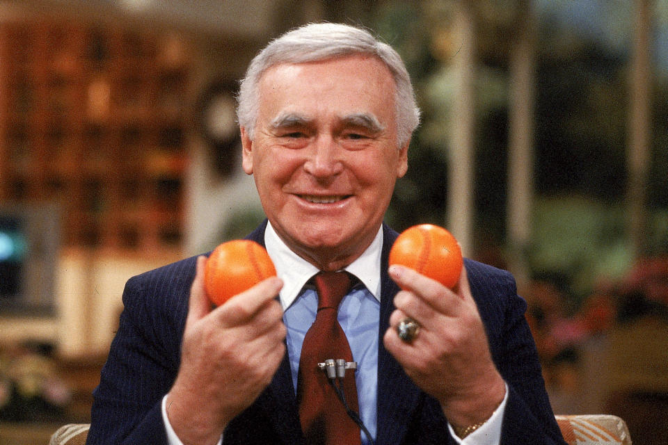 FILE - This Aug. 4, 1981, file photo shows former Athletics baseball team owner Charles O. Finley showing off orange baseballs on "Good Morning America." The Athletics were given permission by then-baseball commissioner Bowie Kuhn to use the baseballs in a couple of spring training games. (AP Photo/Dave Pickoff, File)