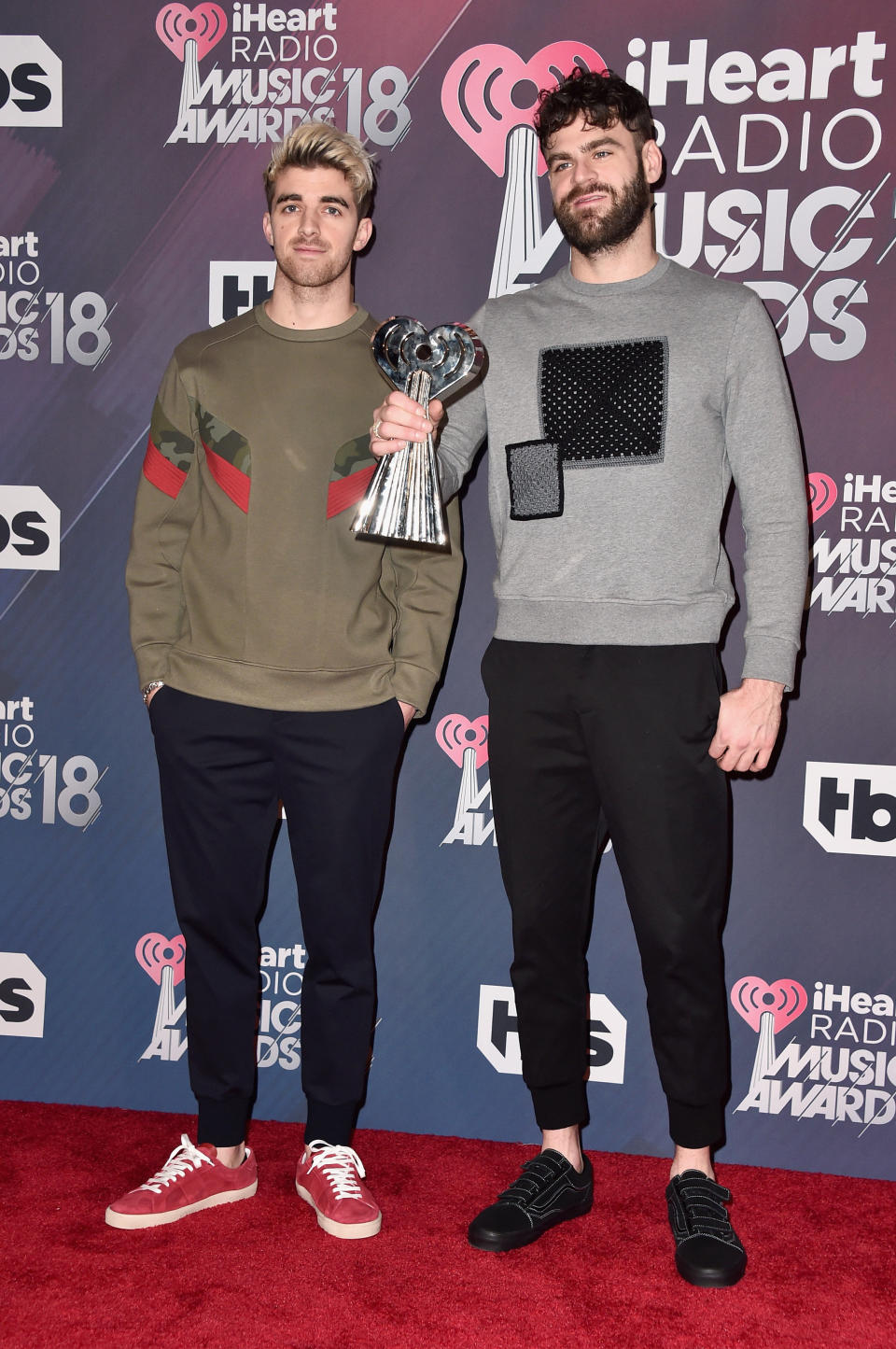 INGLEWOOD, CA - MARCH 11: Andrew Taggart (L) and Alex Pall of The Chainsmokers, winners of the awards for Best Collaboration for 'Something Just Like This;' Dance Artist of the Year; and Dance Album of the Year for 'Memories...Do Not Open' pose in the press room during the 2018 iHeartRadio Music Awards which broadcasted live on TBS, TNT, and truTV at The Forum on March 11, 2018 in Inglewood, California. (Photo by Alberto E. Rodriguez/Getty Images)