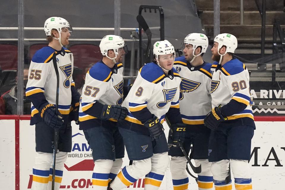 St. Louis Blues left wing Sammy Blais (9) celebrates his goal against the Arizona Coyotes with defenseman Colton Parayko (55), left wing David Perron (57), defenseman Jake Walman and center Ryan O'Reilly (90) during the first period of an NHL hockey game Saturday, April 17, 2021, in Glendale, Ariz. (AP Photo/Ross D. Franklin)