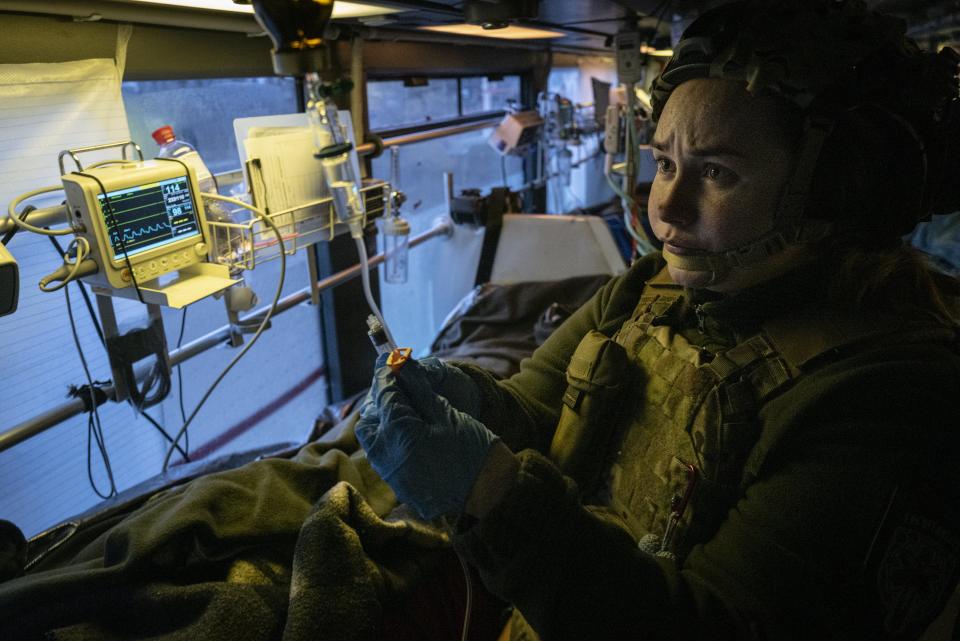 Ukrainian medical team from 'Austriyka' bus evacuate and treat wounded Ukrainian solders in Donbas (Anadolu via Getty Images)