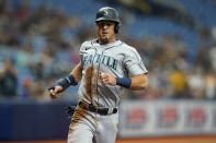 Seattle Mariners' Dylan Moore races home to score on an RBI single by J.P. Crawford off Tampa Bay Rays' Josh Fleming during the third inning of a baseball game Wednesday, Aug. 4, 2021, in St. Petersburg, Fla. (AP Photo/Chris O'Meara)