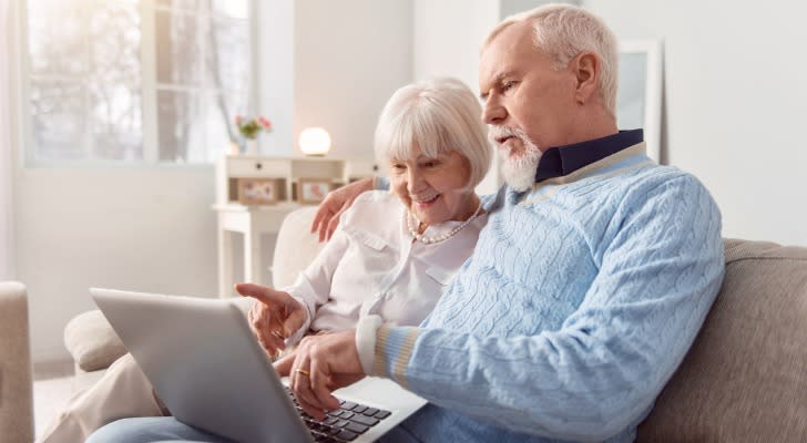 A retired couple looks over their spousal benefits on the Social Security website. 