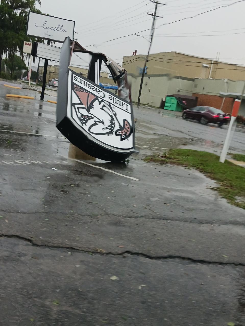 Toppled signs on Lafayette Street after possible tornadoes did extensive damage around Tallahassee on Friday, May 10, 2024.