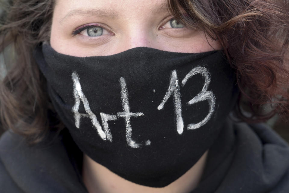 A girl protests against article 13, concerning upload filters, of the Directive on Copyright in the Digital Single Market by the European Union in Leipzig, Germany, Saturday, March 23, 2019. People fear for the freedom of the internet when users content has to pass upload filters to protect copyrights. (Peter Endig/dpa via AP)