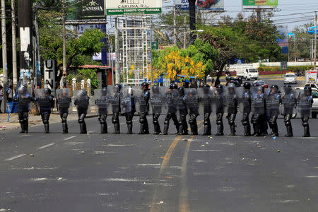 Riot police block a street during a protest in Managua. REUTERS/Oswaldo Rivas