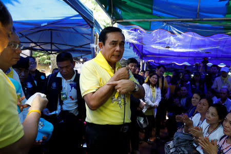 FILE PHOTO: Thailand's Prime Minister Prayut Chan-o-cha speaks as he visits family members near the Tham Luang cave complex during an ongoing search for members of an under-16 soccer team and their coach, in the northern province of Chiang Rai, Thailand, June 29, 2018. REUTERS/Soe Zeya Tun/File Photo