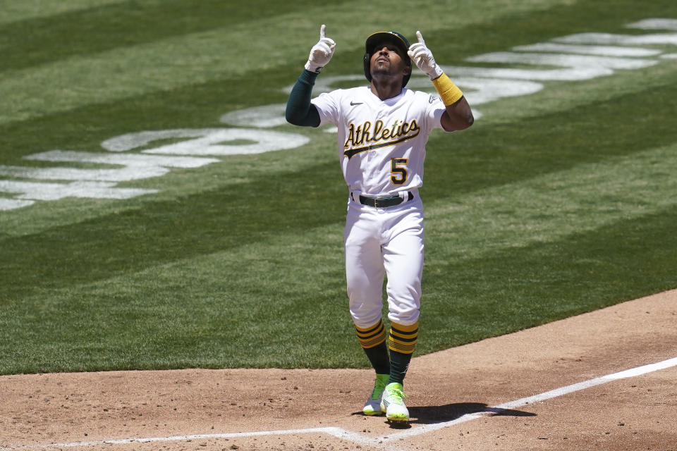 Oakland Athletics' Tony Kemp celebrates after hitting a home run against the Houston Astros during the third inning of a baseball game in Oakland, Calif., Thursday, May 20, 2021. (AP Photo/Jeff Chiu)