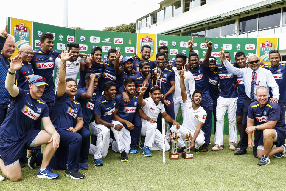 Sri Lanka's cricket team celebrates winning their two five-day cricket tests against South Africa at St. George's Park in Port Elizabeth, South Africa, Saturday, Feb. 23, 2019. (AP Photo/Michael Sheehan)