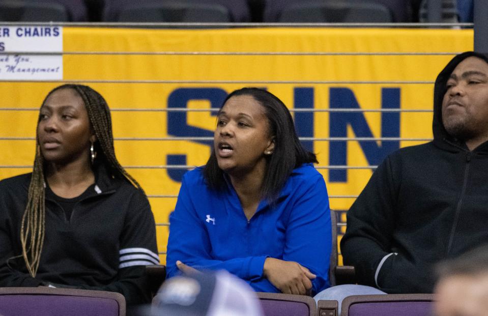 Booker T. Washington girls basketball head coach Jade Brown, center, cheers on former Wildcat Janelle Jones (10) and her Jaguars teammates during Coastal Carolina vs. South Alabama game in the first round of the Sun Belt Conference Women’s Basketball Championship at the Pensacola Bay Center on Tuesday, March 5, 2024.