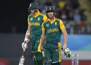 South Africa's AB de Villiers (R) walks off the pitch next to Morne Morkel after being dismissed against Pakistan during their Cricket World Cup match in Auckland, March 7, 2015. REUTERS/Nigel Marple