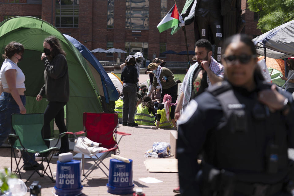 George Washington University police close a student encampment as students demonstrate during a pro-Palestinian protest over the Israel-Hamas war on Friday, April 26, 2024, in Washington. (AP Photo/Jose Luis Magana)