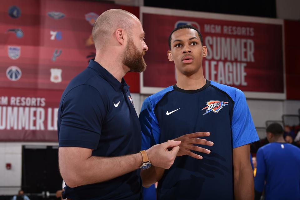 Thunder assistant coach Dave Bliss talks with first-round pick Darius Bazley at summer league on July 8, 2019.
