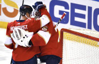 Florida Panthers left wing Frank Vatrano (77) congratulates goaltender Sergei Bobrovsky (72) on a victory over the Boston Bruins following an NHL hockey game Wednesday, Oct. 27, 2021, in Sunrise, Fla. (AP Photo/Jim Rassol)