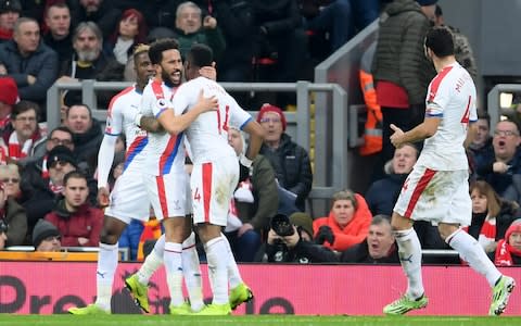 LIVERPOOL, ENGLAND - JANUARY 19: Andros Townsend of Crystal Palace celebrates with teammates after scoring his sides first goal during the Premier League match between Liverpool FC and Crystal Palace at Anfield on January 19, 2019 in Liverpool, United Kingdom - Credit: Getty Images