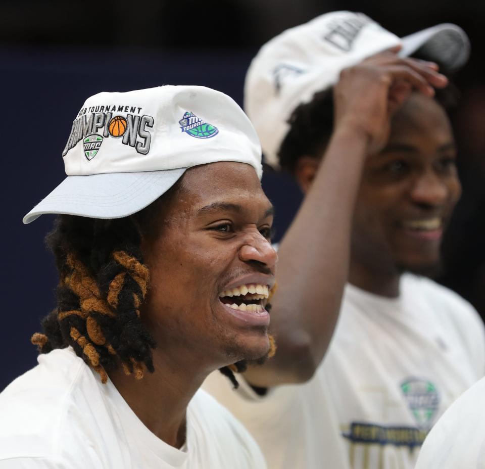 Akron guard Mikal Dawson (22) cheers after the Zips defeated Kent State in the Mid-American Conference Tournament championship game March 16 in Cleveland.
