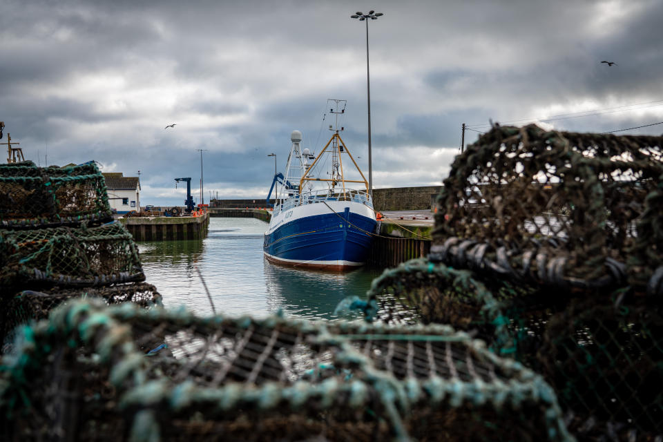 In this Tuesday, Jan. 28, 2020 photo, a fishing vessel is docked at Kilkeel harbor in Northern Ireland. The United Kingdom and the European Union are parting ways on Friday and one of the first issues to address is what will happen to the fishing grounds they shared. (AP Photo/David Keyton)