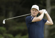 England's Justin Rose reacts after playing his second the shot from the 5th during a practice round ahead of the start of the British Open golf championships at Royal Portrush in Northern Ireland, Tuesday, July 16, 2019. The British Open starts Thursday. (AP Photo/Matt Dunham)