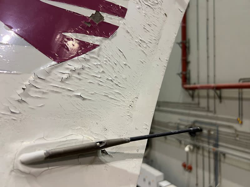 FILE PHOTO: Surface damage seen on Qatar Airways' airbus A350 parked at Qatar airways aircraft maintenance hangar in Doha