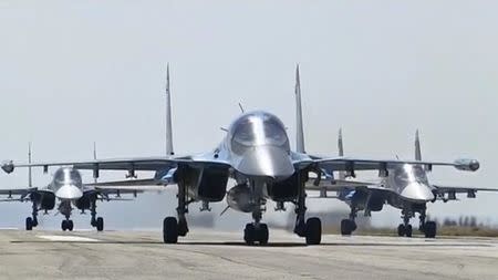 Russian military jets take off from the country's air base in Hmeymin, Syria to head back to Russia, part of a partial withdrawal ordered by President Vladimir Putin, in this still image taken from video March 15, 2016. REUTERS/Russian Ministry of Defence via REUTERS TV