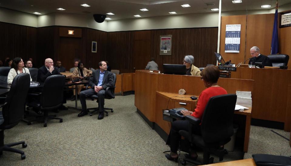 Theodore Wafer and others listen during a motion hearing in Judge Timothy Kenny's courtroom at the Frank Murphy Hall of Justice in Detroit, Friday, April 25, 2014. Wafer has been accused of fatal shooting 19-year-old Renisha McBride on the porch of his home. Kenny removed Judge Qiana Lillard on Friday from the case of Wafer. Defense attorneys argued Lillard's previous employment with the prosecutor's office and associations with employees created an appearance of impropriety. (AP Photo/Detroit Free Press, Eric Seals) DETROIT NEWS OUT; NO SALES