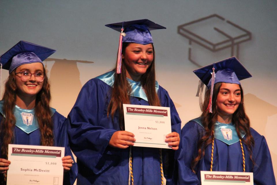 Sophia McDevitt, Jenna Nelson and Rebeca Cacheo receive a Beasley-Mills Memorial Scholarship during the Senior Awards Assembly on Wednesday, May 15, 2024, at Perry Performing Arts Center.