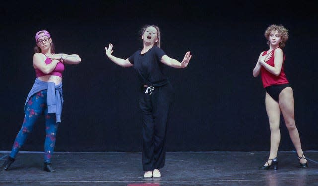 Cynthia Krebs Lee, as Hot Box Club dancer Miss Adelaide, sings “A Bushel and a Peck” during a Hingham Civic “Guys and Dolls” rehearsal. Dancing with her are Jess Phaneuf, left, and Elle Krebs, right.