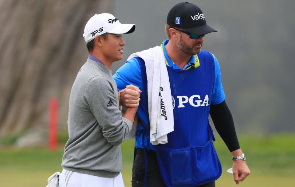 Collin Morikawa celebrates with his caddie JJ Jakovac after holing his putt on the 18th during the final round at Harding Park.