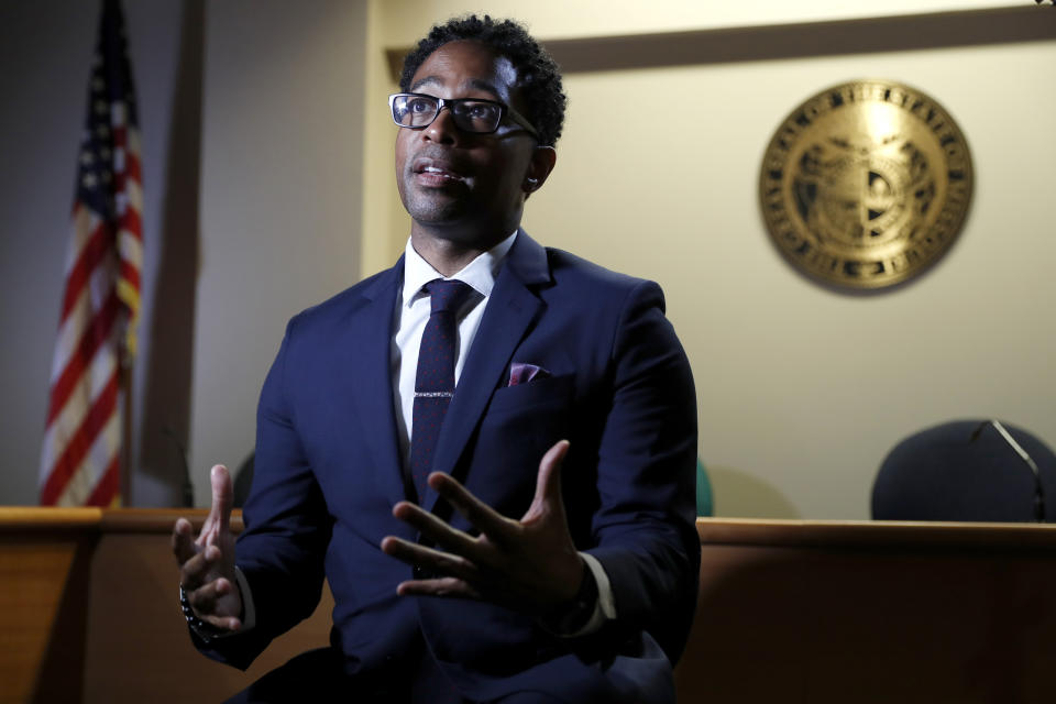 In this July 29, 2019, photo, St. Louis County Prosecutor Wesley Bell speaks during an interview in Clayton, Mo. Bell was a municipal judge and attorney in 2014 and lived a few blocks from the Ferguson Police Department. After the decision by then-Prosecutor Bob McCulloch not to charge a Ferguson police officer in the death of Michael Brown, Bell ran against the 28-year incumbent and won, leading to significant changes in the way the office is run. (AP Photo/Jeff Roberson)