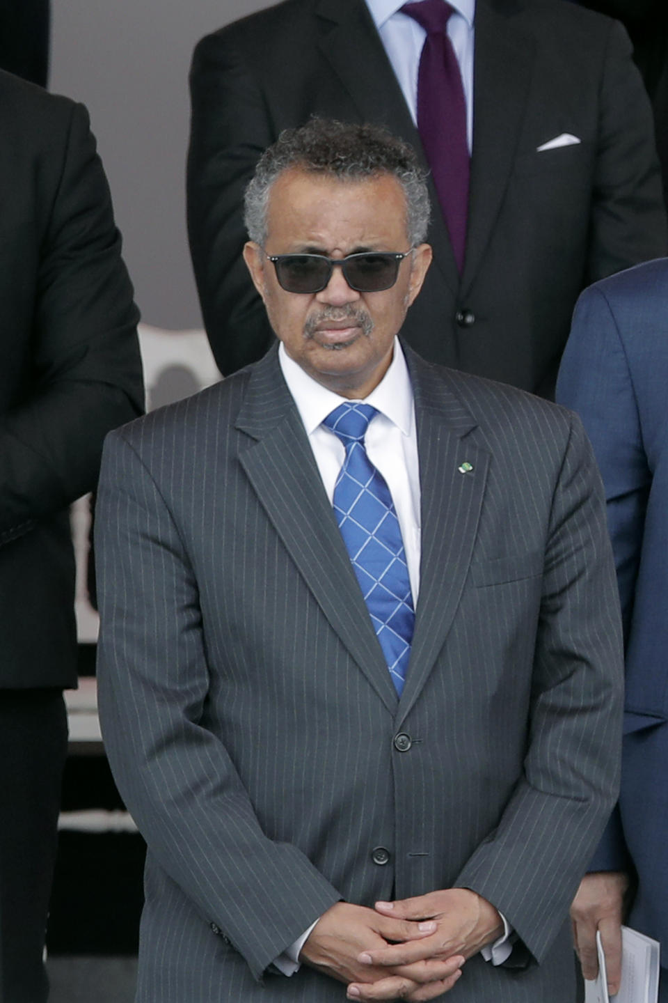 Director General of the World Health Organization, Tedros Adhanom Ghebreyesus, attends the Bastille Day military parade, Tuesday, July 14, 2020 in Paris. France are honoring nurses, ambulance drivers, supermarket cashiers and others on its biggest national holiday Tuesday. Bastille Day's usual grandiose military parade in Paris is being redesigned this year to celebrate heroes of the coronavirus pandemic. (AP Photo/Christophe Ena, Pool)