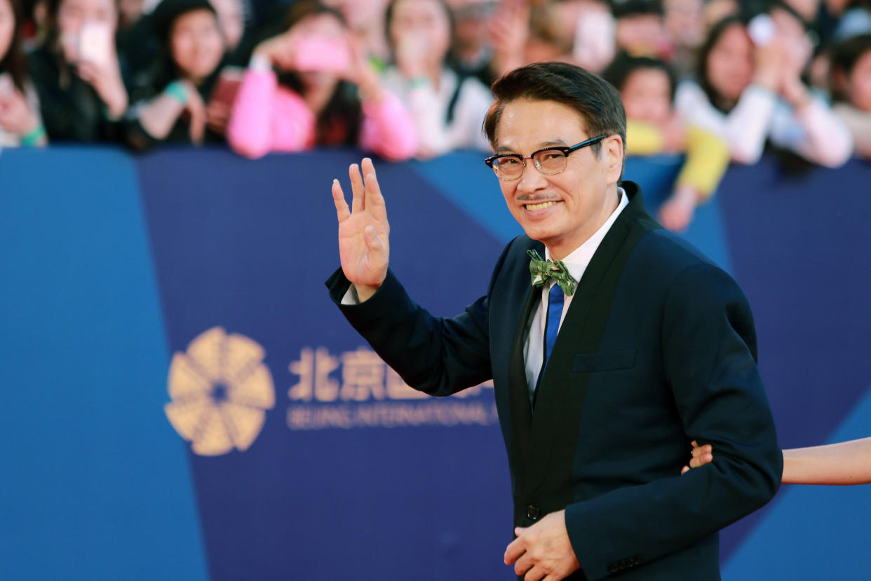 BEIJING, CHINA - APRIL 16:  (CHINA OUT) Actor Ng Man Tat arrives at the red carpet of the 5th Beijing International Film Festival at Yanqi Lake on April 16, 2015 in Beijing, China.  (Photo by Visual China Group via Getty Images)