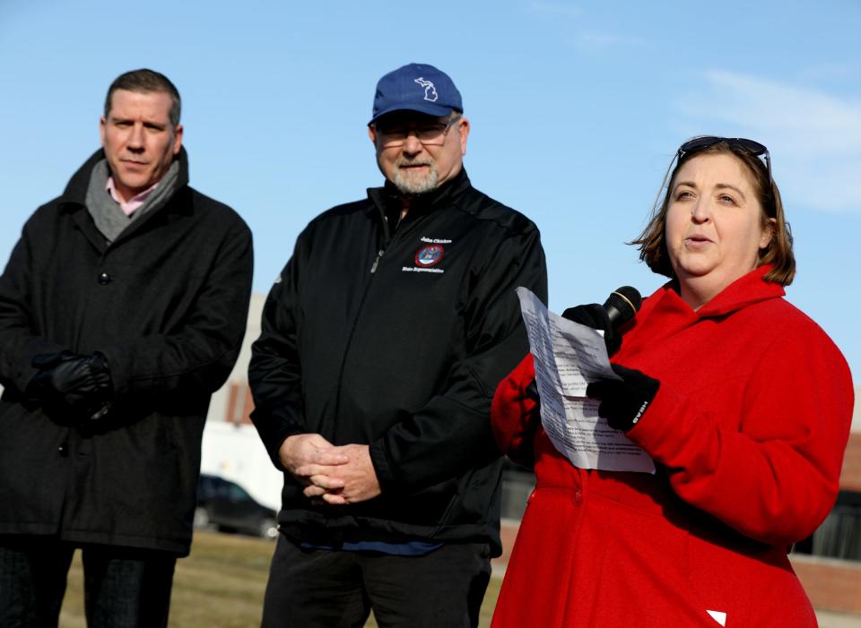 (L to R) Michigan State Rep. Nate Shannon, D-Sterling Heights, and then-state Rep. John Chirkun, D-Roseville, listen as fellow state Rep. Lori Stone, D-Warren, talks to the crowd during a UAW prayer vigil outside the FCA Warren Truck Assembly Plant in Warren, Michigan on February 22, 2019. Over 50 people gathered for thoughts and prayers for all UAW workers going through hard times and uncertainty with General Motors and other auto manufacturers.