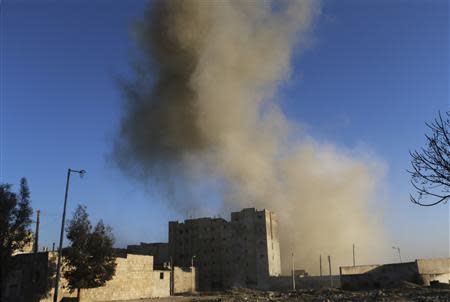 Smoke rises after what activists said was shelling by forces loyal to Syria's President Bashar al-Assad, in the al-Myassar neighbourhood of Aleppo February 7, 2014. REUTERS/Hosam Katan