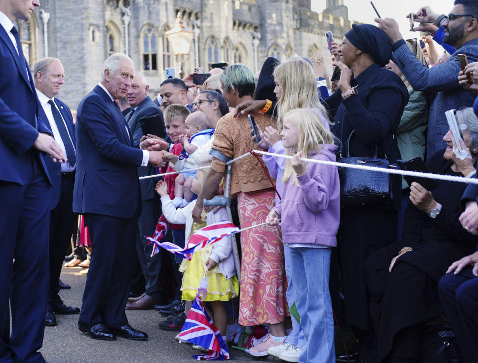 King Charles III meets members of the public as he leaves Cardiff Castle, Wales, Friday, Sept. 16, 2022. King Charles III and Camilla, the Queen Consort, arrived in Wales for an official visit. The royal couple previously visited to Scotland and Northern Ireland, the other nations making up the United Kingdom, following the death of Queen Elizabeth II at age 96 on Thursday, Sept. 8. (Ben Birchall/PA via AP)