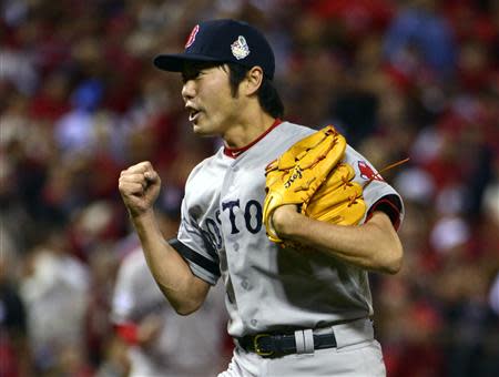 Oct 28, 2013; St. Louis, MO, USA; Boston Red Sox relief pitcher Koji Uehara (19) celebrates after game five of the MLB baseball World Series against the St. Louis Cardinals at Busch Stadium. REUTERS