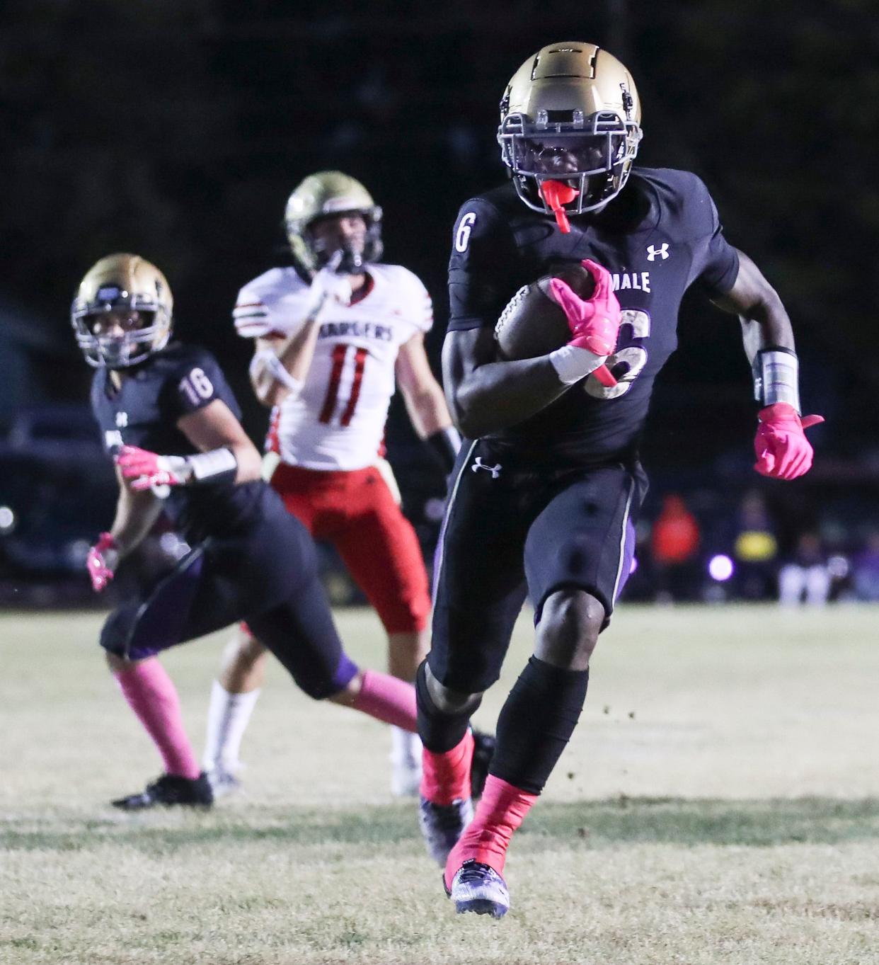 Male's Chayce Burton scores a touchdown against Bullitt East in October 2023.