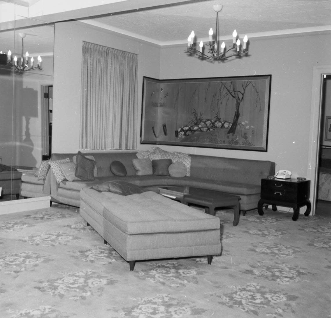 Mirrored wall with corner couch and Chinese wall hanging, Suite 850, Hotel Texas, prepared for President and Mrs. John F. Kennedy, photographed on Nov. 19, 1963