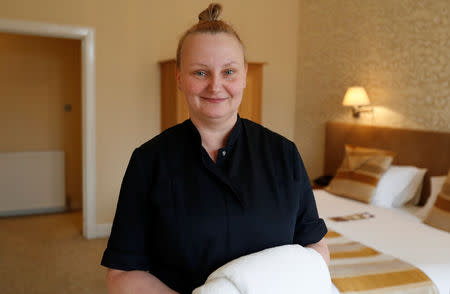 Marta Ofiarska, a housekeeper, poses for a picture at Glen Mhor Hotel in Inverness, Scotland, Britain March 8, 2019. Picture taken March 8, 2019. REUTERS/Russell Cheyne