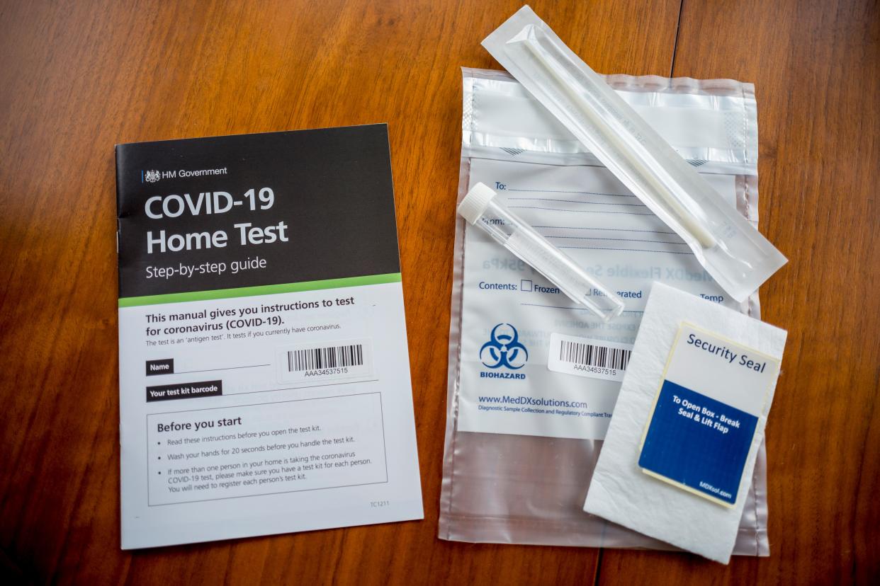 A photograph taken in London on August 18, 2020 shows the contents of a UK Government COVID-19 antigen home test kit. - The antigen test determines whether you are currently infected with the novel coronavirus. (Photo by Tolga Akmen / AFP) (Photo by TOLGA AKMEN/AFP via Getty Images)