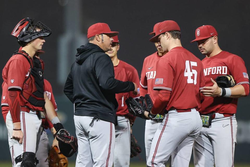 Stanford pitching coach Thomas Eager chats with players during a game against Oklahoma earlier this season.