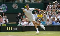 Grigor Dimitrov of Bulgaria hits a shot during his match against Richard Gasquet of France at the Wimbledon Tennis Championships in London, July 3, 2015. REUTERS/Suzanne Plunkett