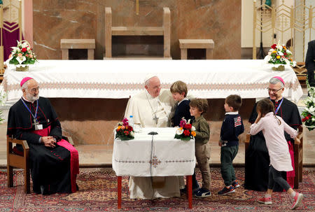 Pope Francis meets children during a meeting with representatives of other Christian denominations at Saint Peter's Cathedral in Rabat, Morocco, March 31, 2019. REUTERS/Remo Casilli