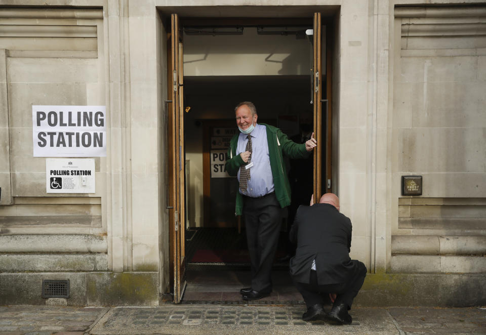 Staff open a polling station ahead of local council elections in London, Thursday May 6, 2021. Millions of people across Britain will cast a ballot on Thursday, in local elections, the biggest set of votes since the 2019 general election. A Westminster special-election is also taking place in Hartlepool, England. (AP Photo/Matt Dunham)