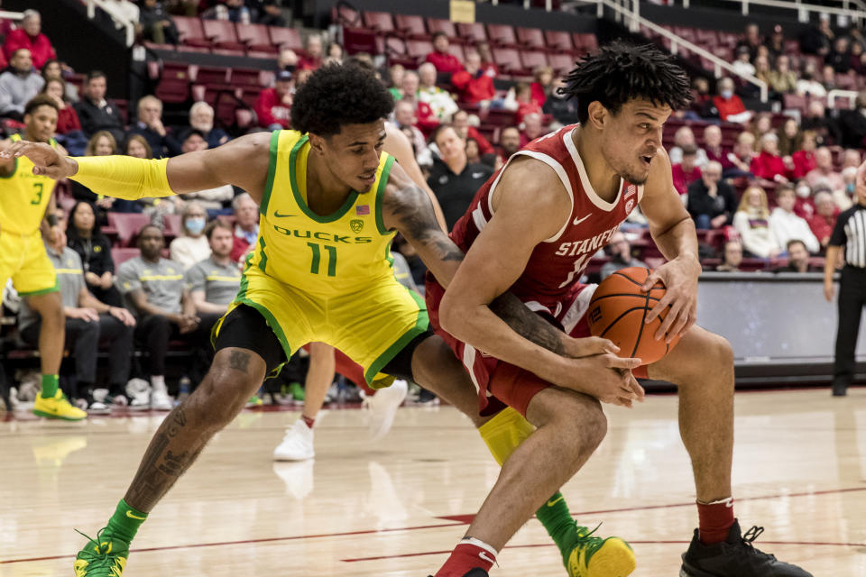 Stanford forward Spencer Jones, right, gets possession of the ball from from Oregon guard Rivaldo Soares during the second half of an NCAA college basketball game in Stanford, Calif., Saturday, Jan. 21, 2023. Stanford won 71-64. (AP Photo/John Hefti)